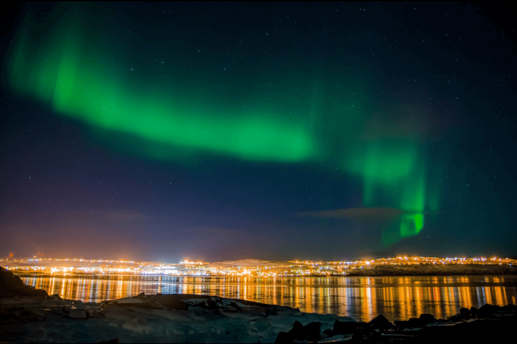 Aurora over city